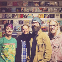 Four people at Atomic Disc